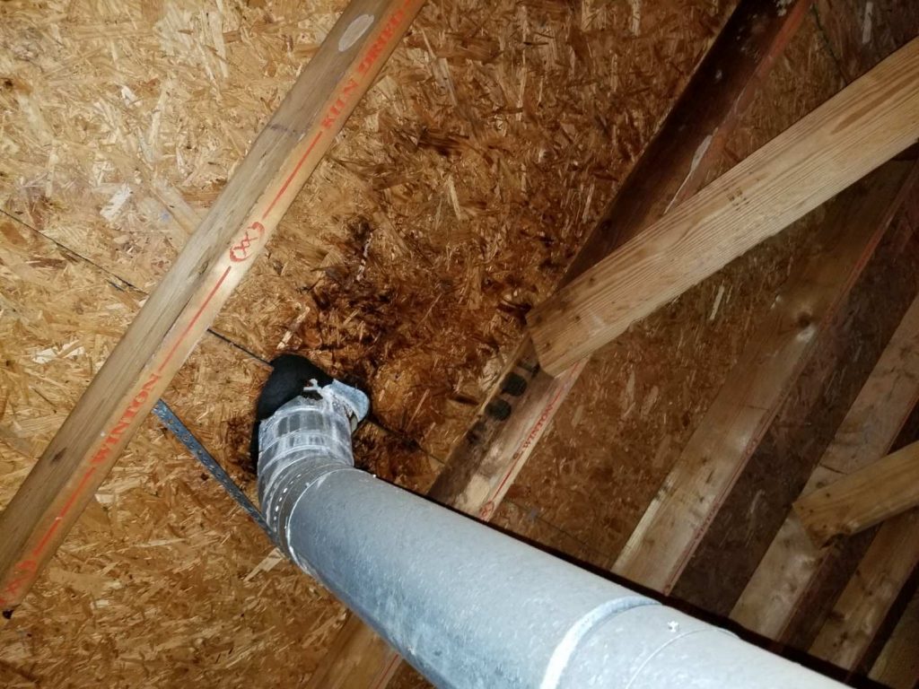 picture of a vent pipe too close to the roof found on a home inspection