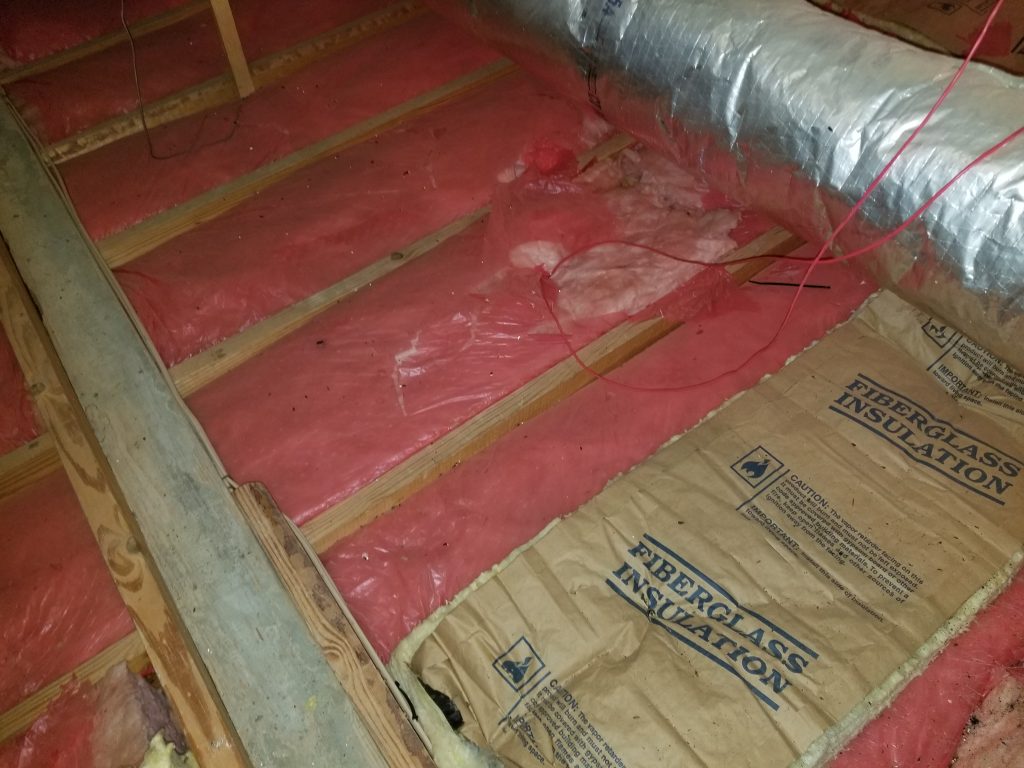 checking insulation during a home inspection